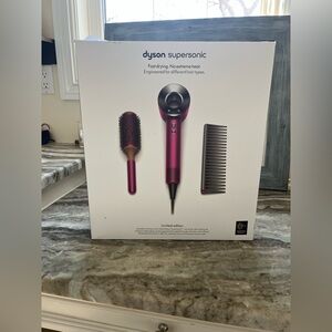 Dyson blow dryer and original box (Barely used)